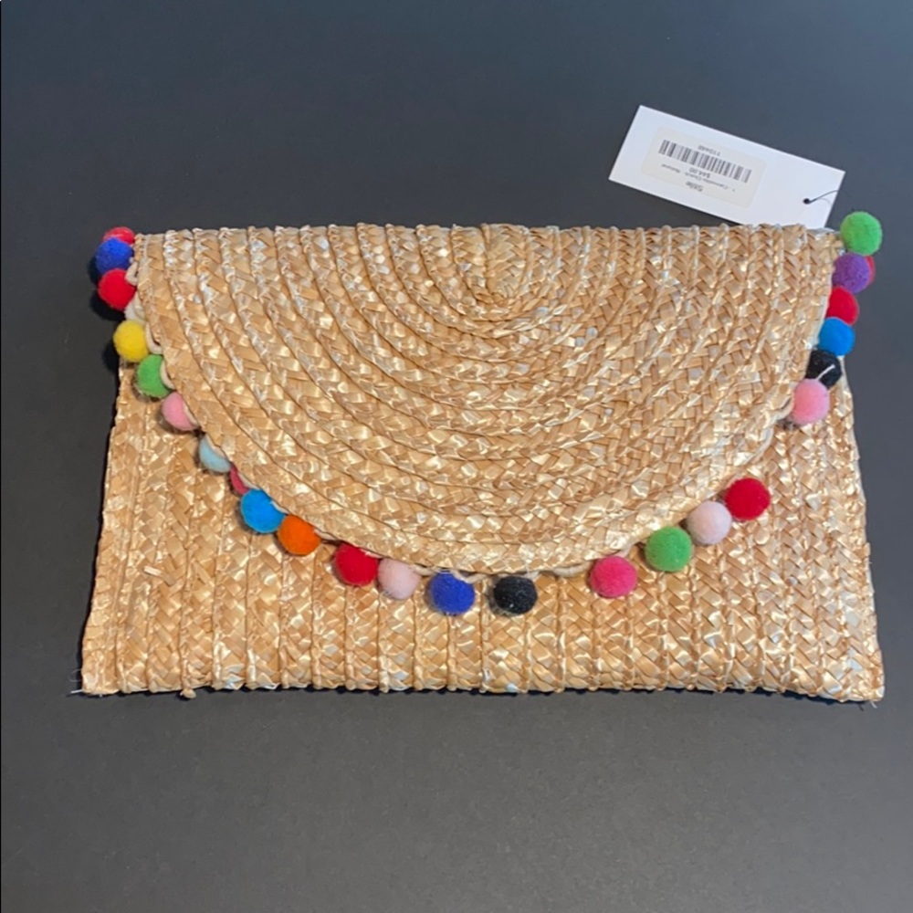 colorful pom pom clutch